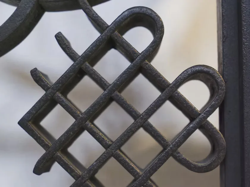How to beat Moodboard inspiration overload and find your own style Close-up of wrought iron gate pattern, dark metal texture.